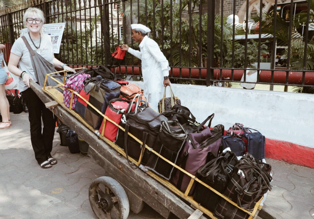 A simple teal paper airplane icon with black outlines.